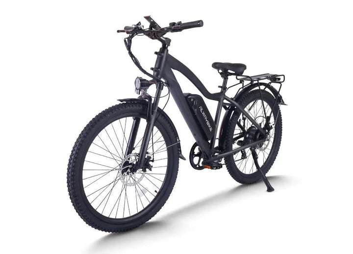 A real electric mountain bike shown outdoors on a mixed-surface route, illustrating the article's terrain-first buying approach.