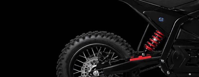 Close-up of the CEMOTO D03 rear shock and suspension