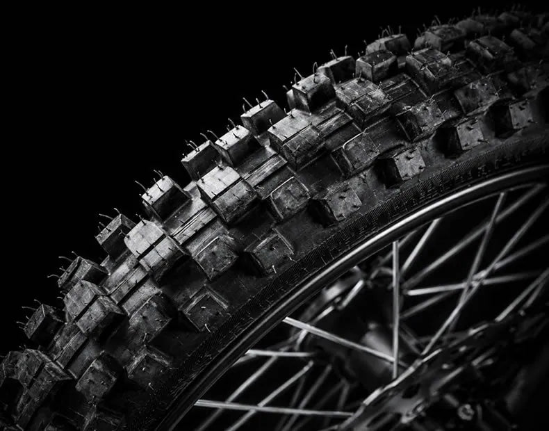 Close-up of a CEMOTO D03 knobby off-road tire
