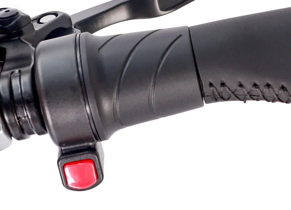 Black ebike thumb throttle with red switch on handlebar grip